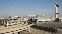 "International terminal, train, and control tower at New York's Kennedy Airport"