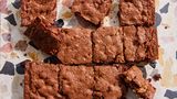 a super close up, overhead view of brownies cooled and cut into squares.