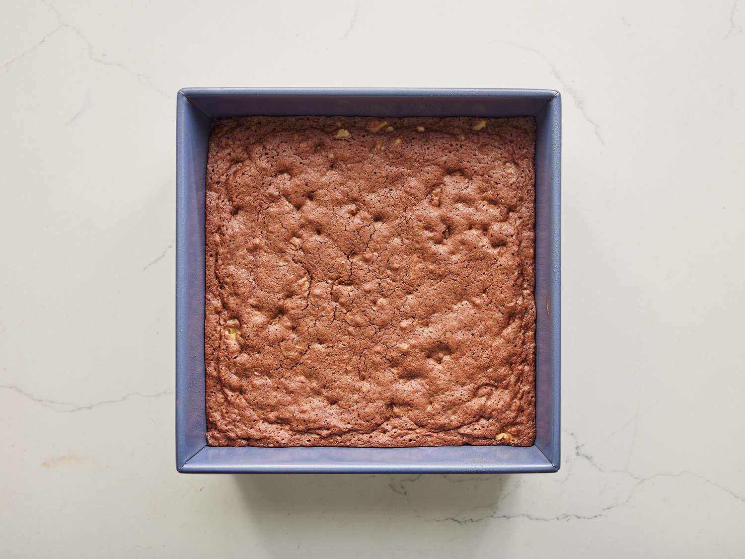 an overhead view of brownies baked perfectly, hot out of the oven. 