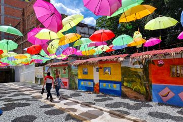 Decorated entrance with hanging umbrellas at Junin market in Medellin, Colombia