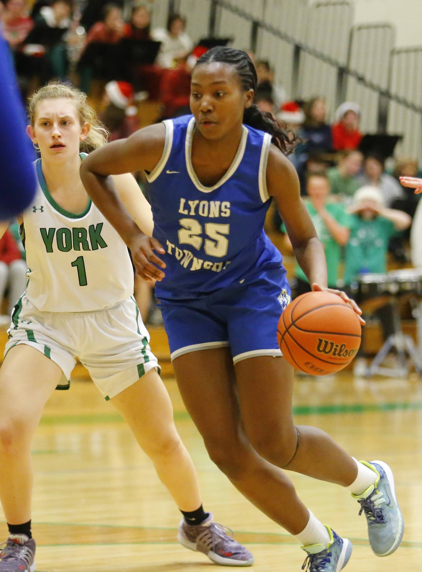 Lyons' Nora Ezike (25) drives to the basket during the girls varsity basketball game between Lyons Township and York high schools on Friday, Dec. 16, 2022 in Elmhurst, IL.