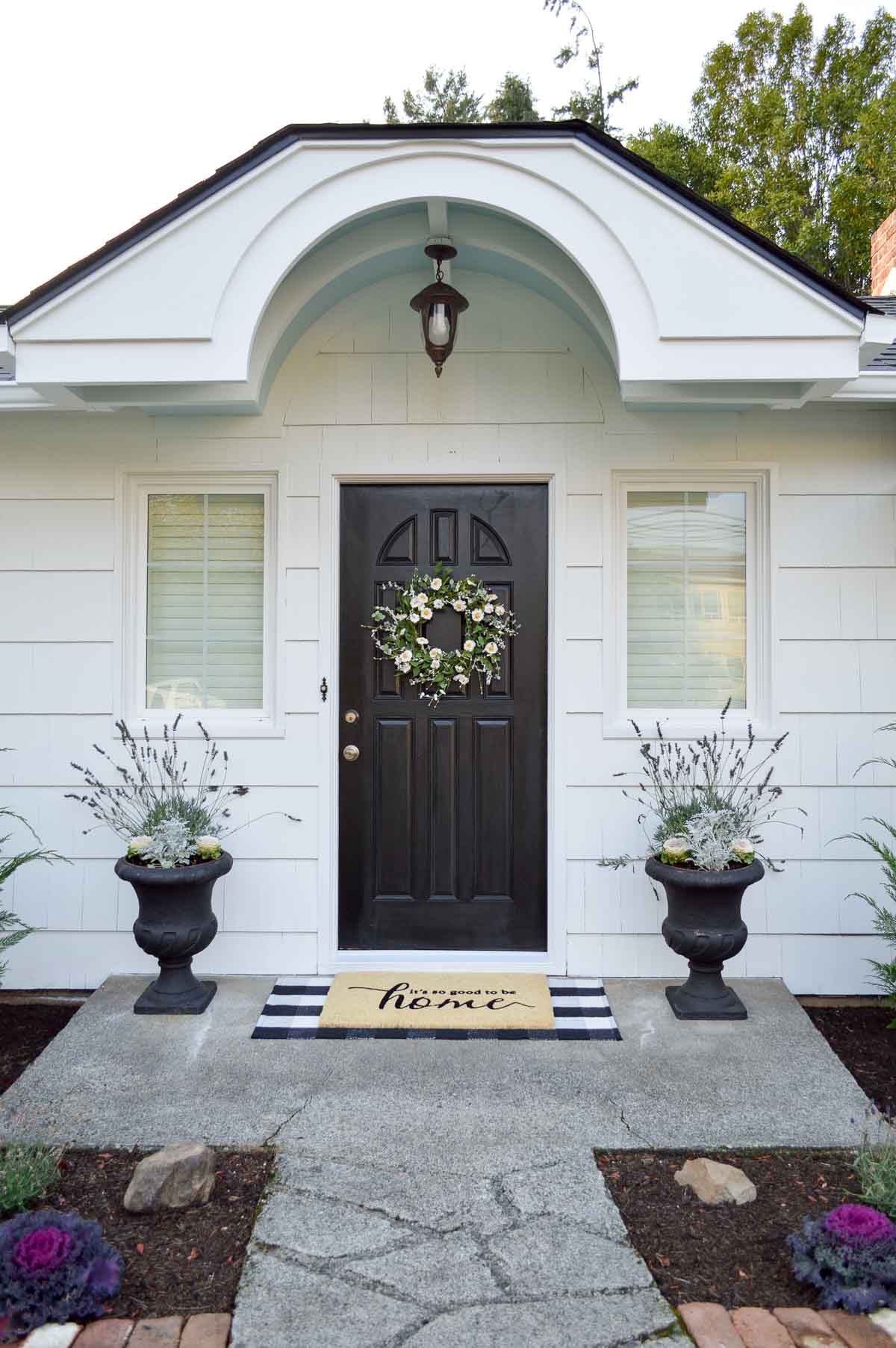 iron ore front door on a white cottage