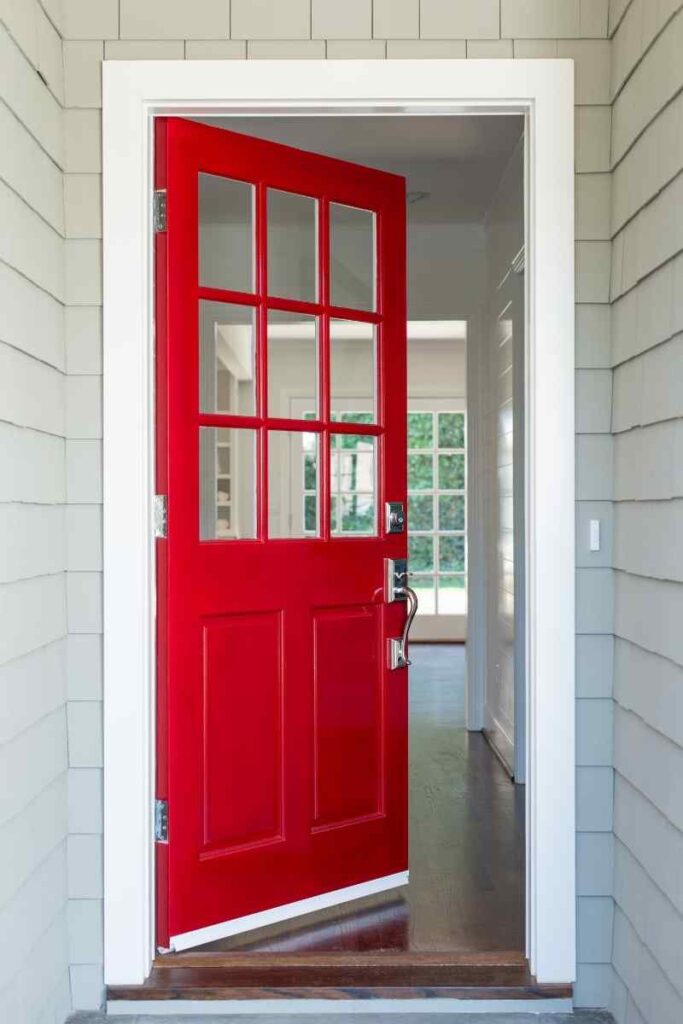 home with gray siding, bright red front door